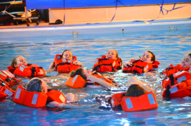 Students in the swimming pool learning sea safety