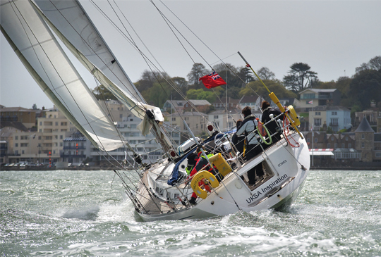 Yachting boat out on the water with people onboard