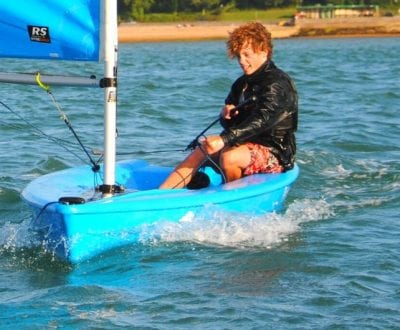 A young male UKSA students enjoying dinghy sailing