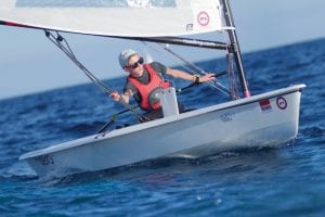 A young student navigating a dinghy