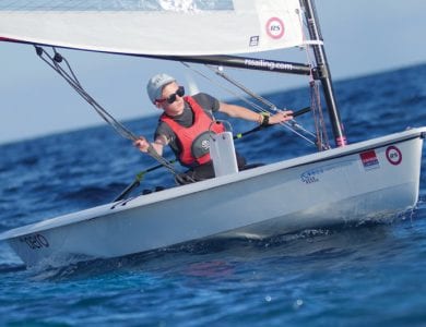 A young student navigating a dinghy