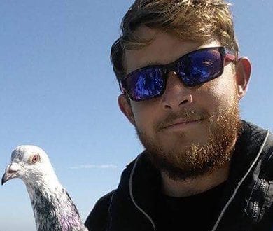 A UKSA student with his pigeon