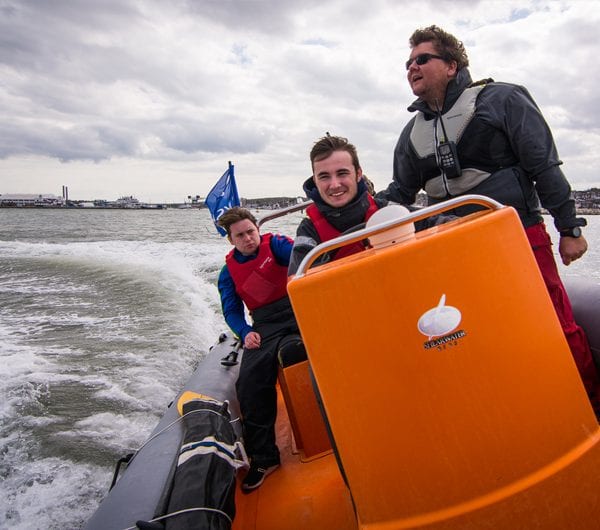 A powerboat instructor teaching students