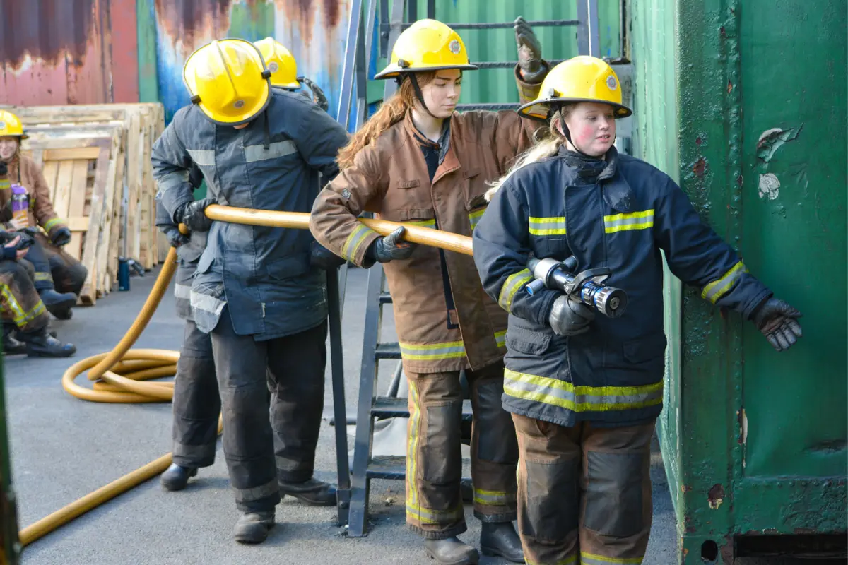 A group of students learning firefighting