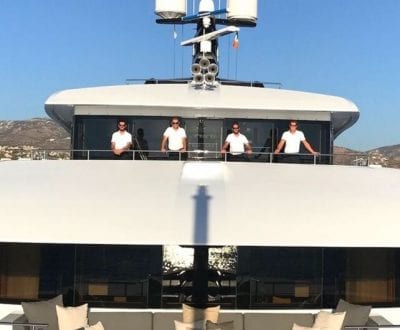 A group shot of superyacht crew onboard a superyacht