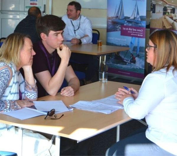 A careers course advisor talking to open day attendees