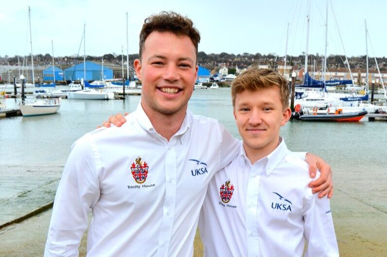 Two young adults posing for a picture in UKSA uniform