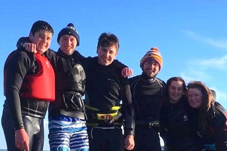 A group of watersports students in a row