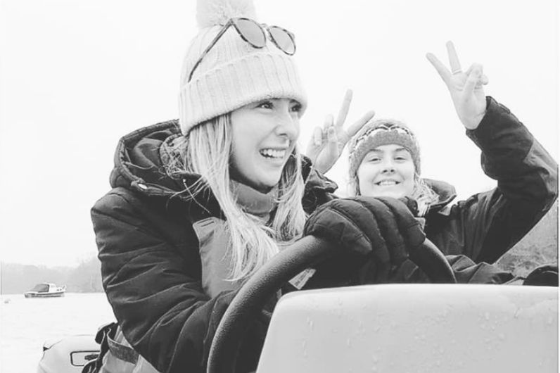 Maria Chant on a powerboat with fellow student